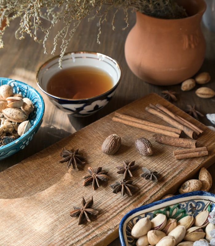 Natural herbal ingredients arranged on a dark wooden surface